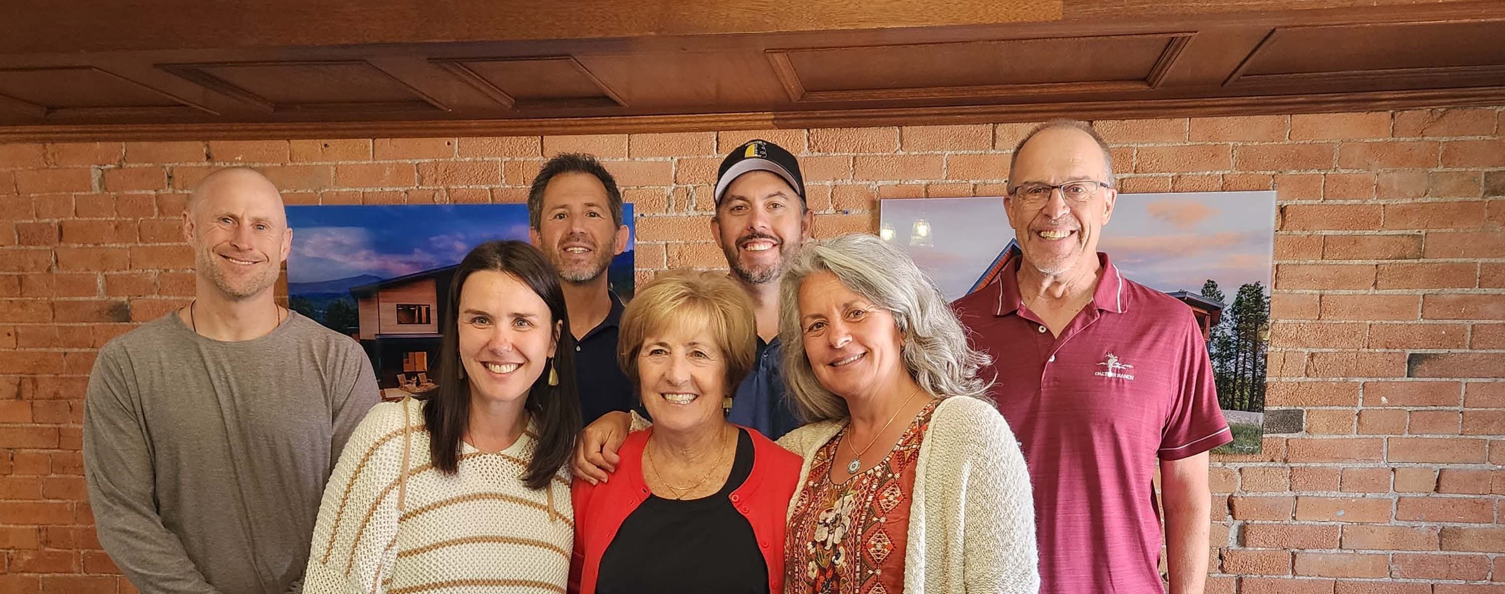 DEF trustees and staff together in front of a brick wall